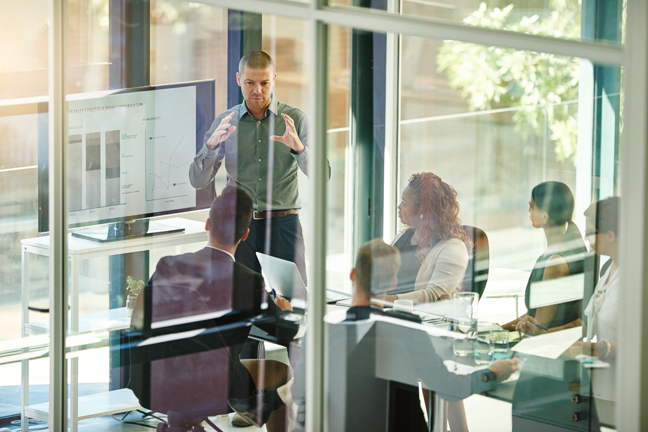 Business people, tech or advice in boardroom for training, productivity report or feedback chart on screen. Speaker, team or corporate presentation in office for company growth with brand management.